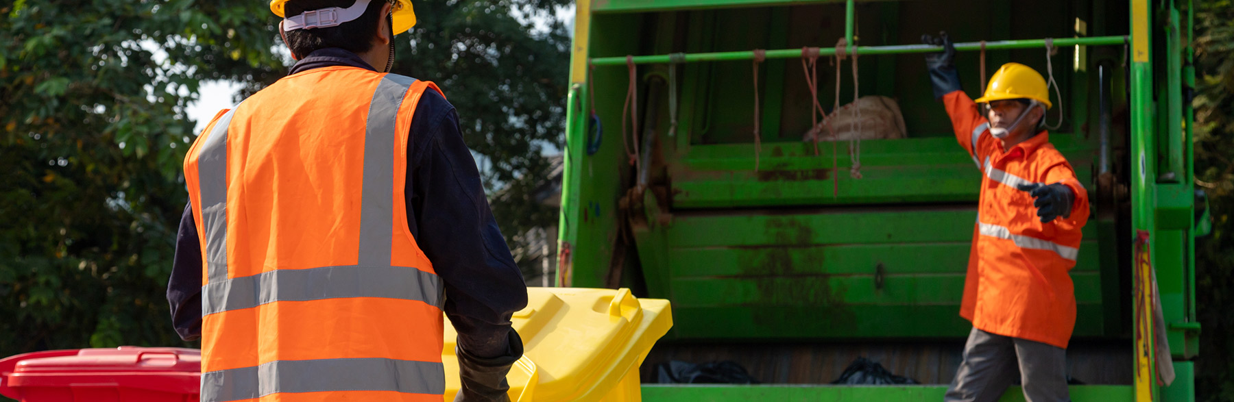 Photo of trash waste collectors engaged in Waste Management in New England Photo of trash waste collectors engaged in Waste Management in New England